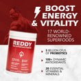 Load image into Gallery viewer, Dynamic image of an active individual enjoying a post-workout smoothie made with Reddy Red Organic Superfood Powder, visually demonstrating the product's energy and vitality boosting properties.